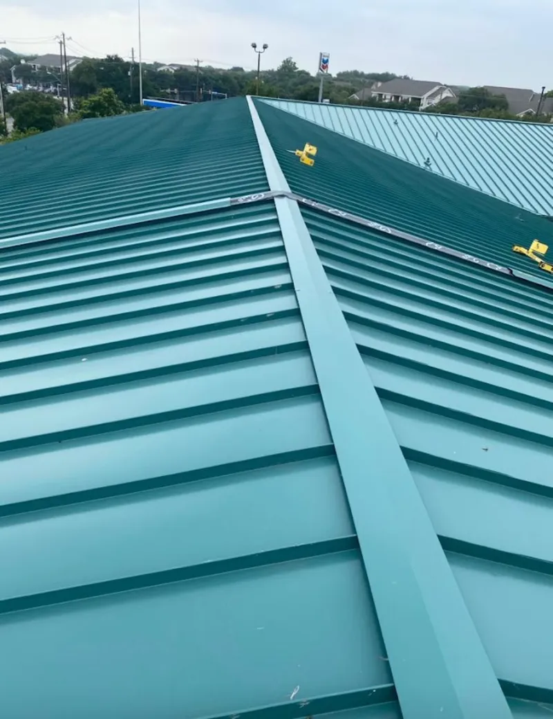 Green commercial metal roof ridge and valley for Metal Roof Repair in Greenfield